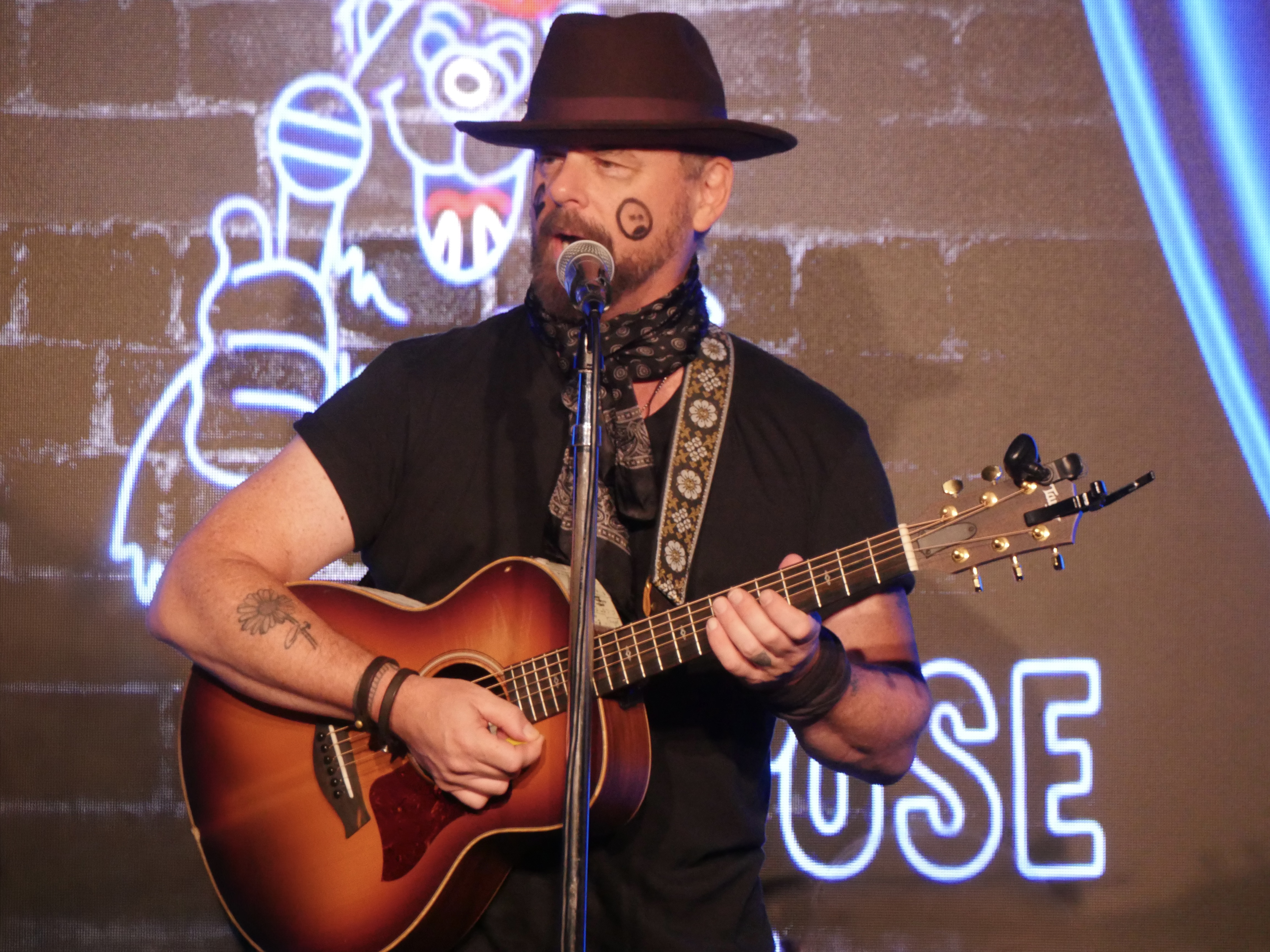Rob Johnston playing guitar on stage